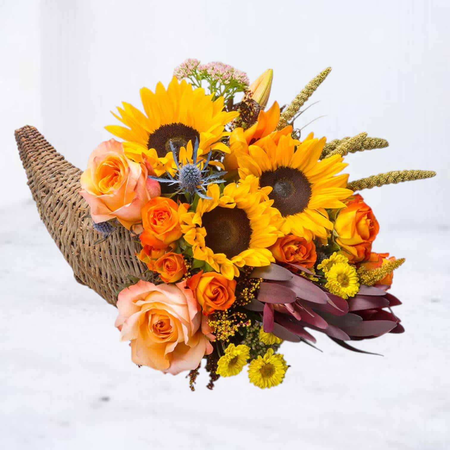 Bouquet of sunflowers and orange roses in a woven wrap