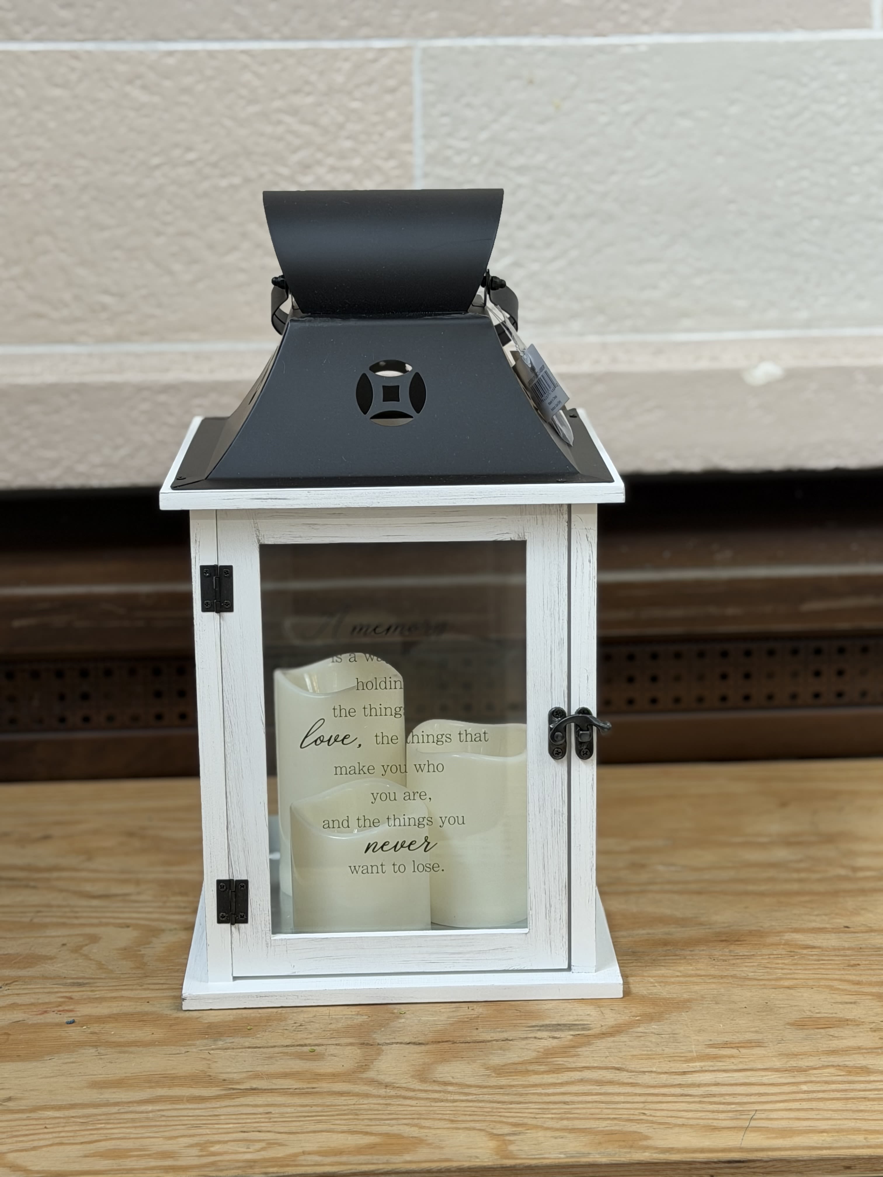 3 Candle Large Lantern  - A 3 candle lantern.  Lantern Reads: "A memory is a way of holding onto the things you love, the things that make you who you are, and the things you never want to lose."