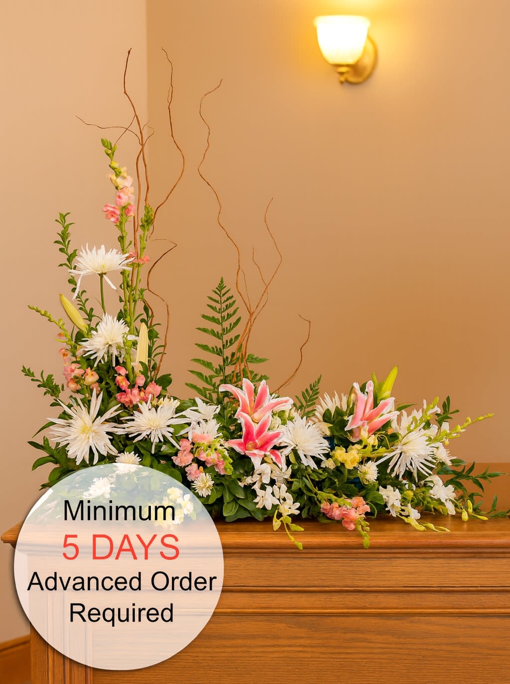Watanabe Memories With You (Urn) - Celebrate the cherished memories with a loved one using this beautiful piece designed for an urn or picture frame. Featuring a stunning arrangement of flowers, it adds a heartfelt and elegant touch to the memorial. Please note that a minimum of 5 days' advance notice is required to ensure the flowers can be properly staged for quality results.   Photographs with frames (if any) must be no larger than 10" wide and are required to be dropped off at our Kalihi shop 5 days prior to the service.   Key Features:  Stunning Dimensions: Measures approximately 30" high and 34" wide, creating an impressive and elegant display.  High-Quality Arrangement: Expertly crafted with a selection of fresh, beautiful flowers to ensure lasting beauty and impact.  Elegant Presentation: Perfect for memorials, celebrations of life, or any event where a beautiful and heartfelt tribute is desired.  Meaningful Tribute: Designed to honor and celebrate the life of a loved one with grace and elegance.  