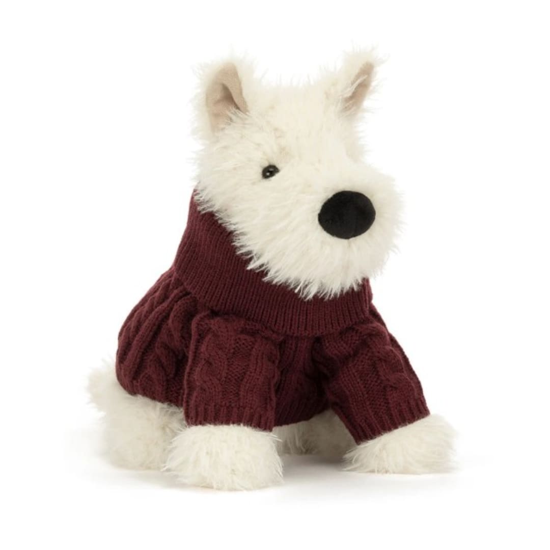 White plush dog wearing a burgundy sweater on a white background