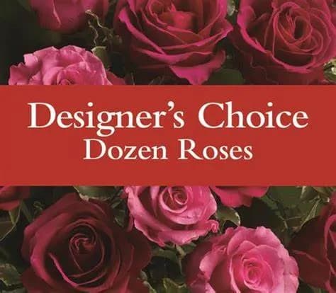 Dozen roses in shades of pink and red with a text banner across the center