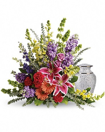 Colorful floral arrangement with a silver urn vase