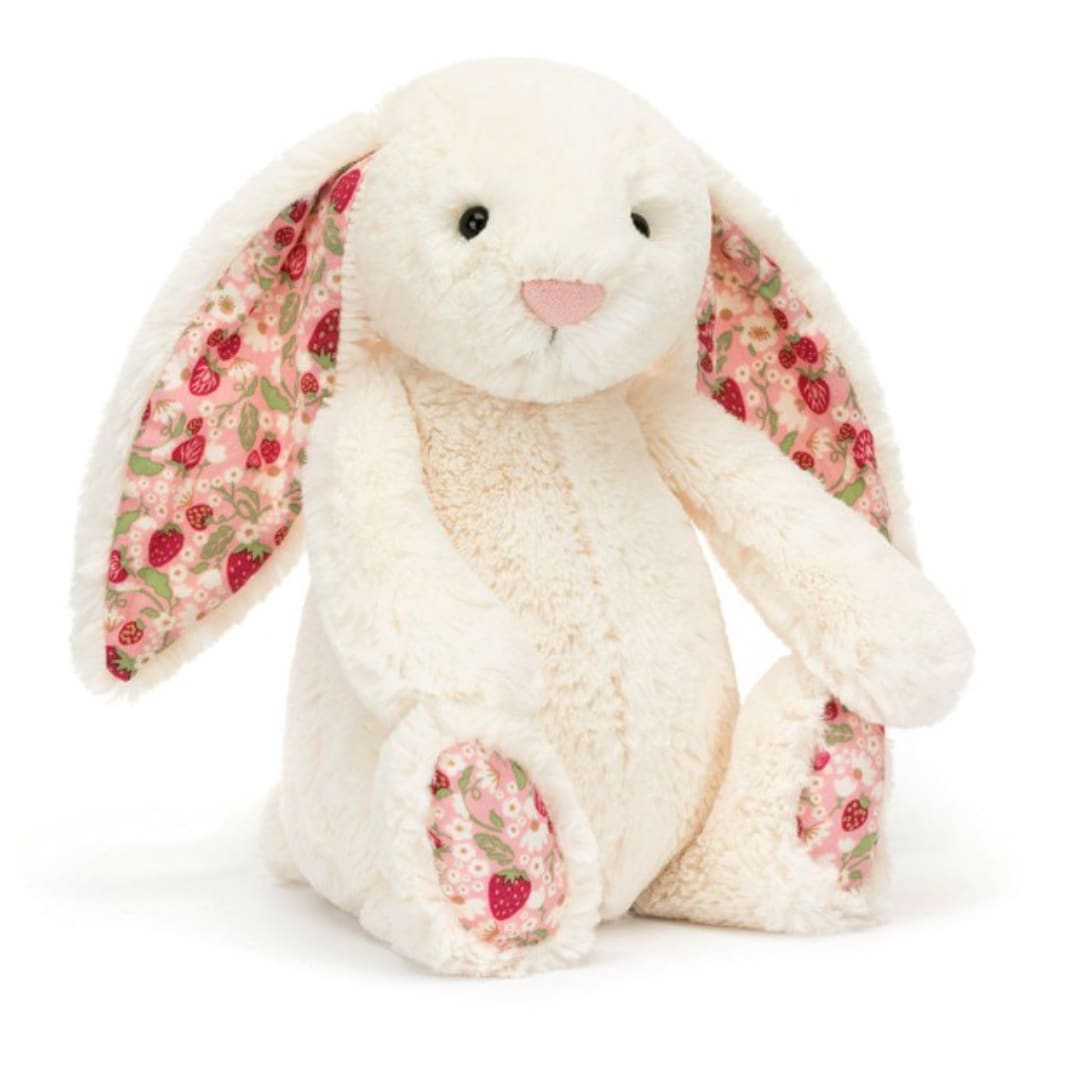 White plush bunny with pink patterned ears and paws