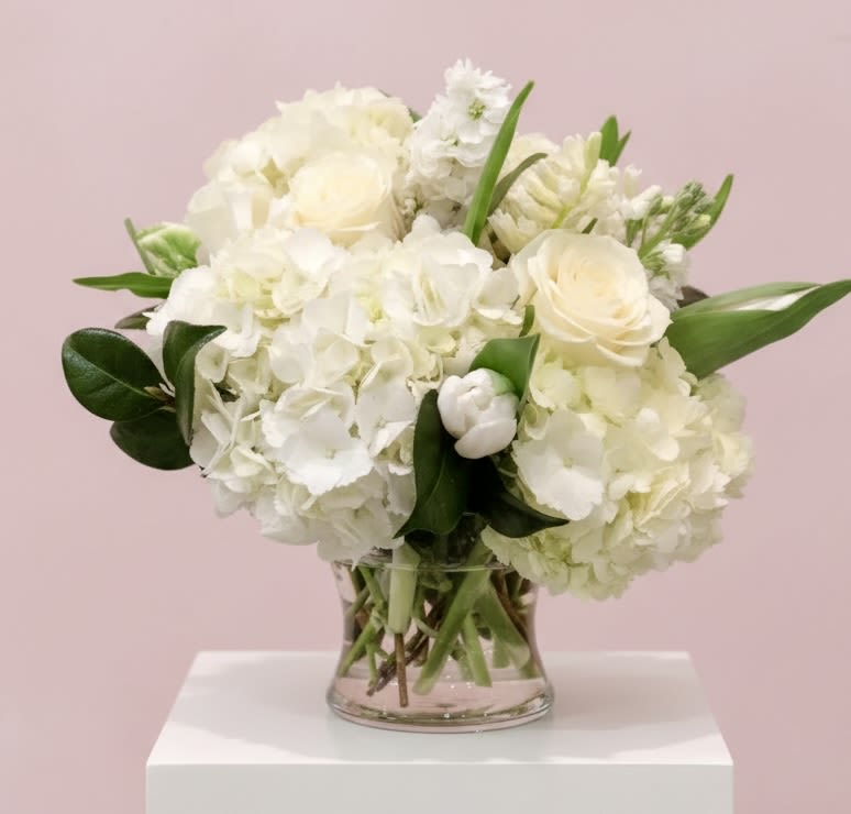 White floral bouquet in a clear glass vase
