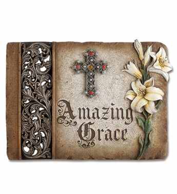 Decorative book cover with a cross and white lilies