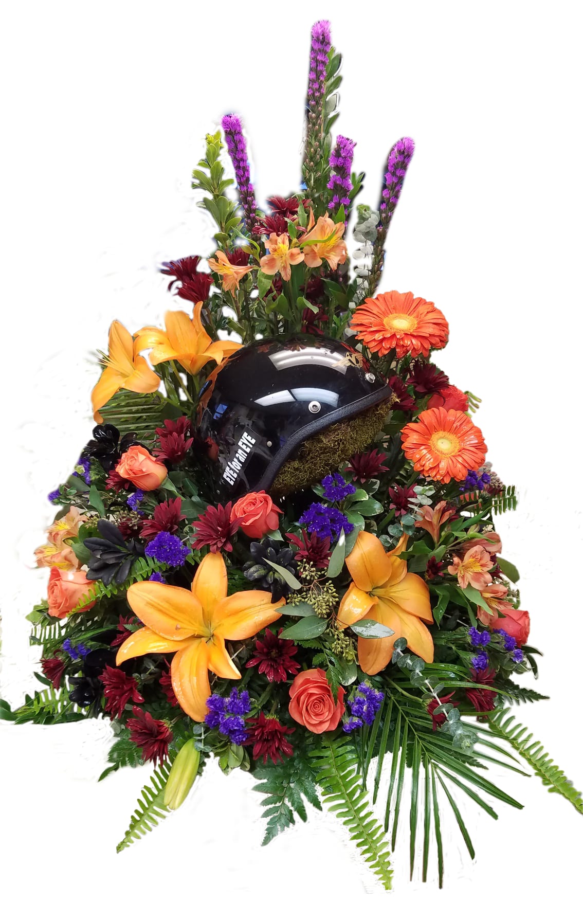 Floral arrangement with a black motorcycle helmet in the center