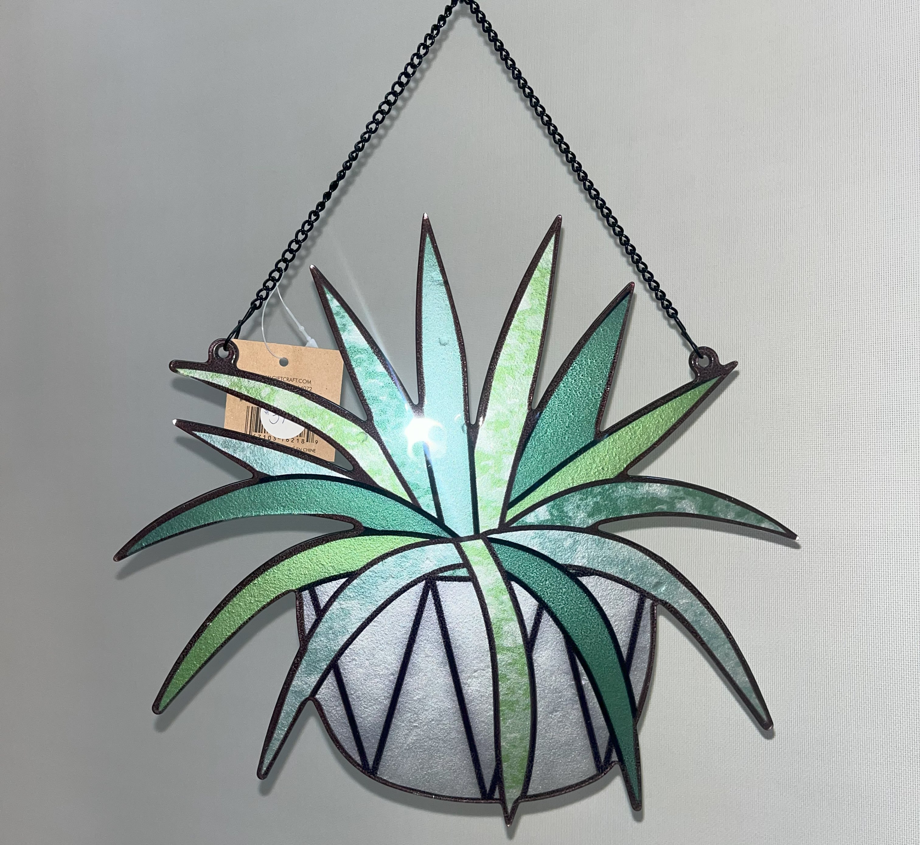 Hanging stained-glass-style wall art shaped like a potted plant