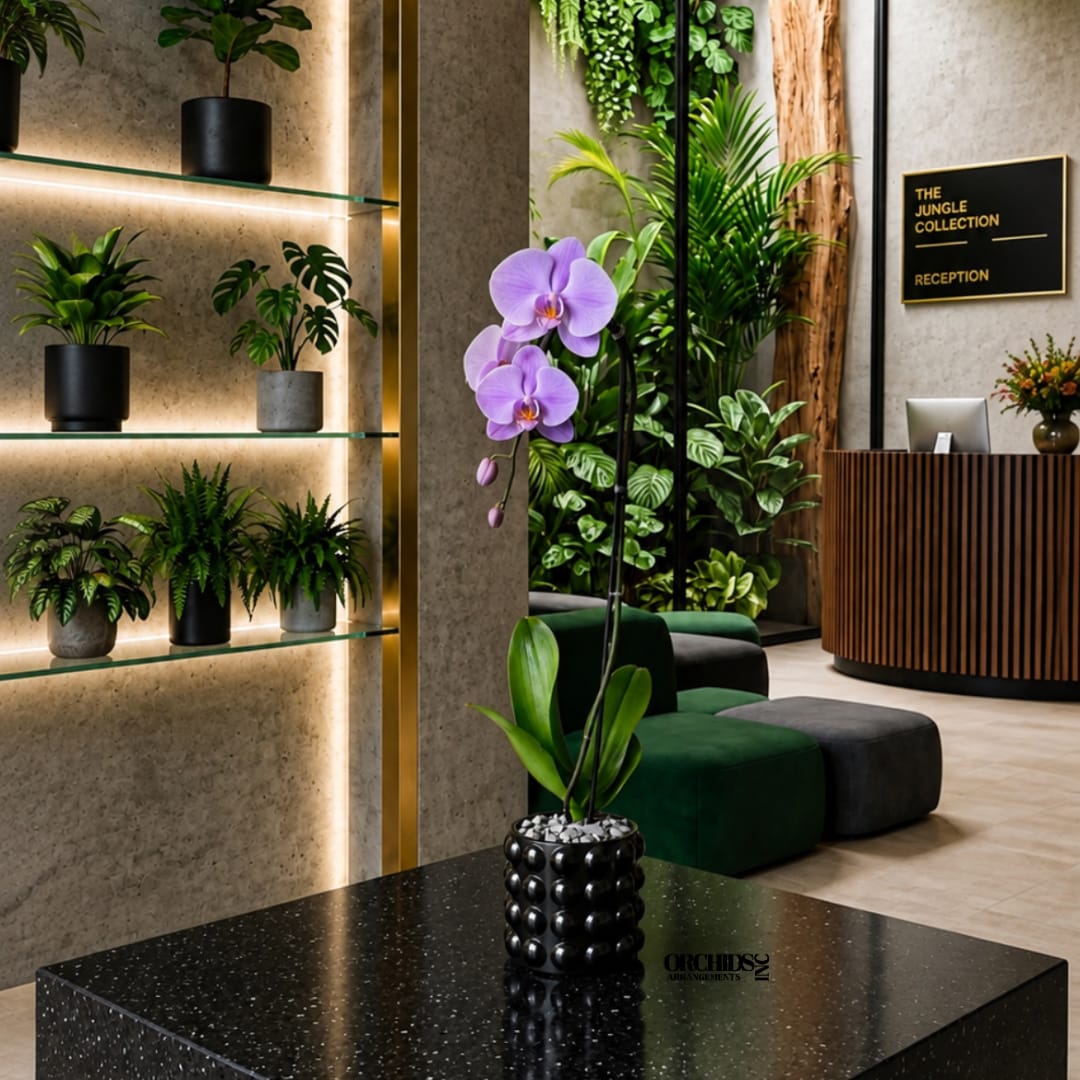 Purple orchid in a black textured pot on a glossy table