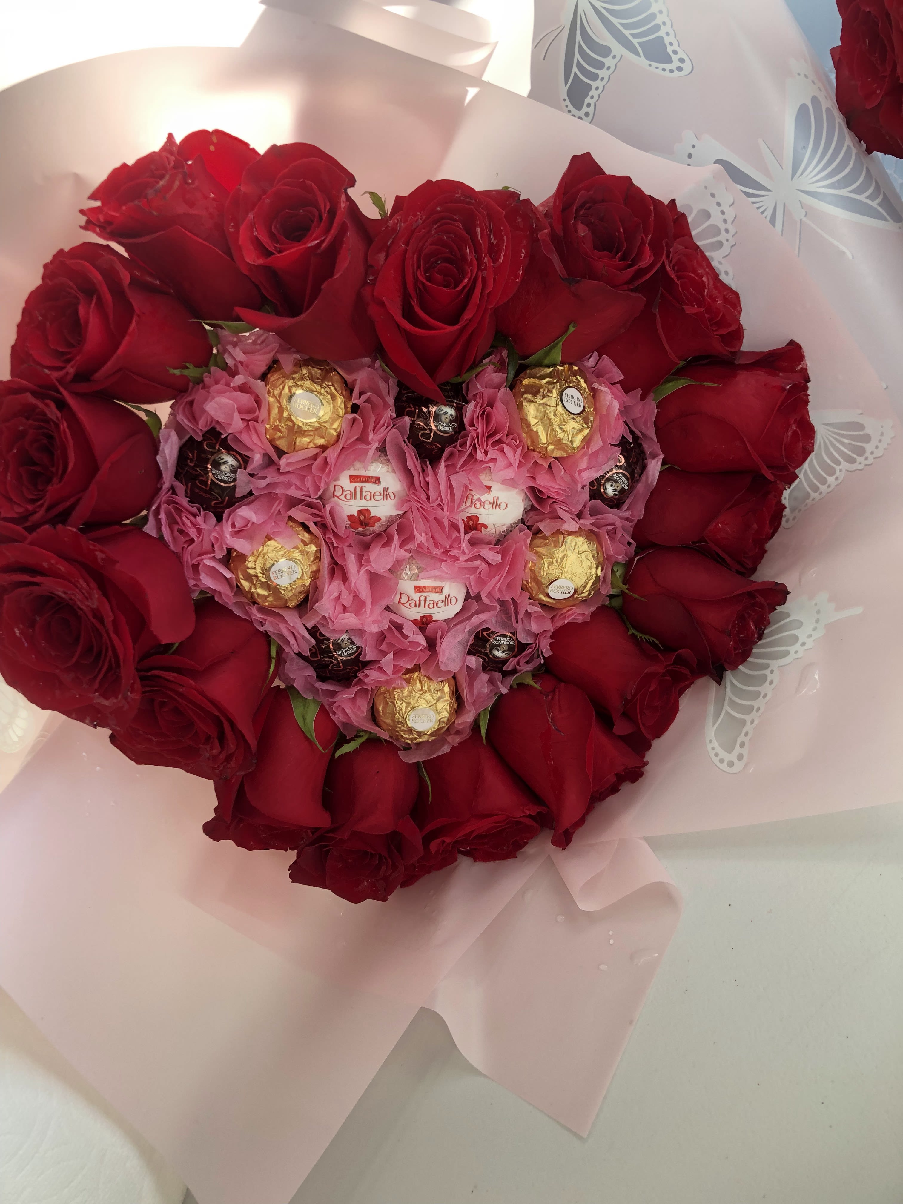 Heart-shaped bouquet of red roses with Ferrero Rocher chocolates