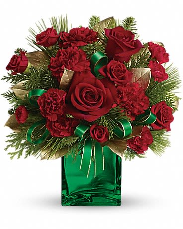 Red roses and carnations in a green glass vase with ribbon