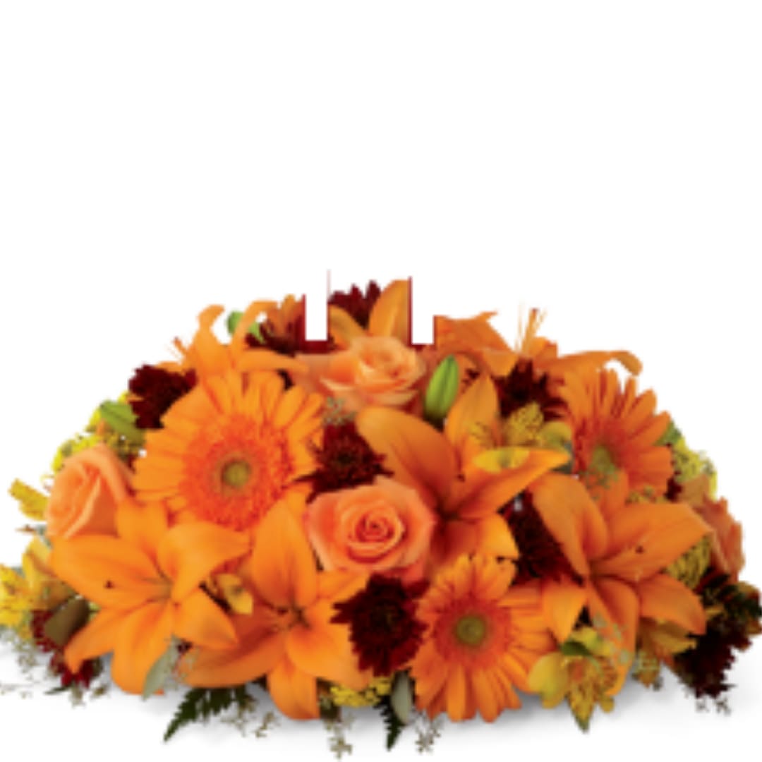 Orange floral arrangement with lilies, gerbera daisies, and roses