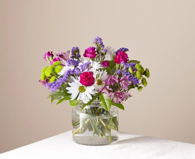 Wild Berry Bouquet - The best things in life are sweet, vibrant and blooming with freshness. Our Wild Berry Bouquet embodies all that and more with its rich blend of white, pink and purple florals to create the perfect impression.  The Original Bouquet is approximately 12"H x 13"W.