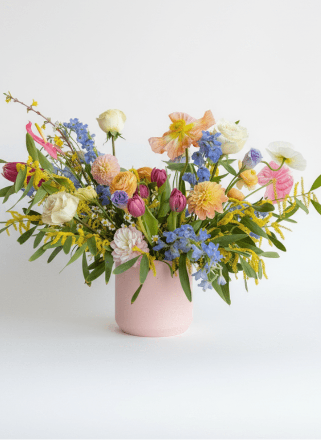 Colorful mixed bouquet in a pink vase