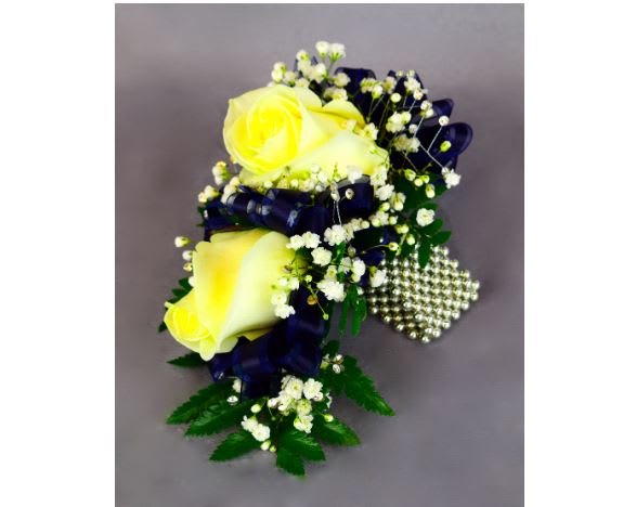 Yellow rose corsage with baby's breath, navy ribbon, and pearl accents