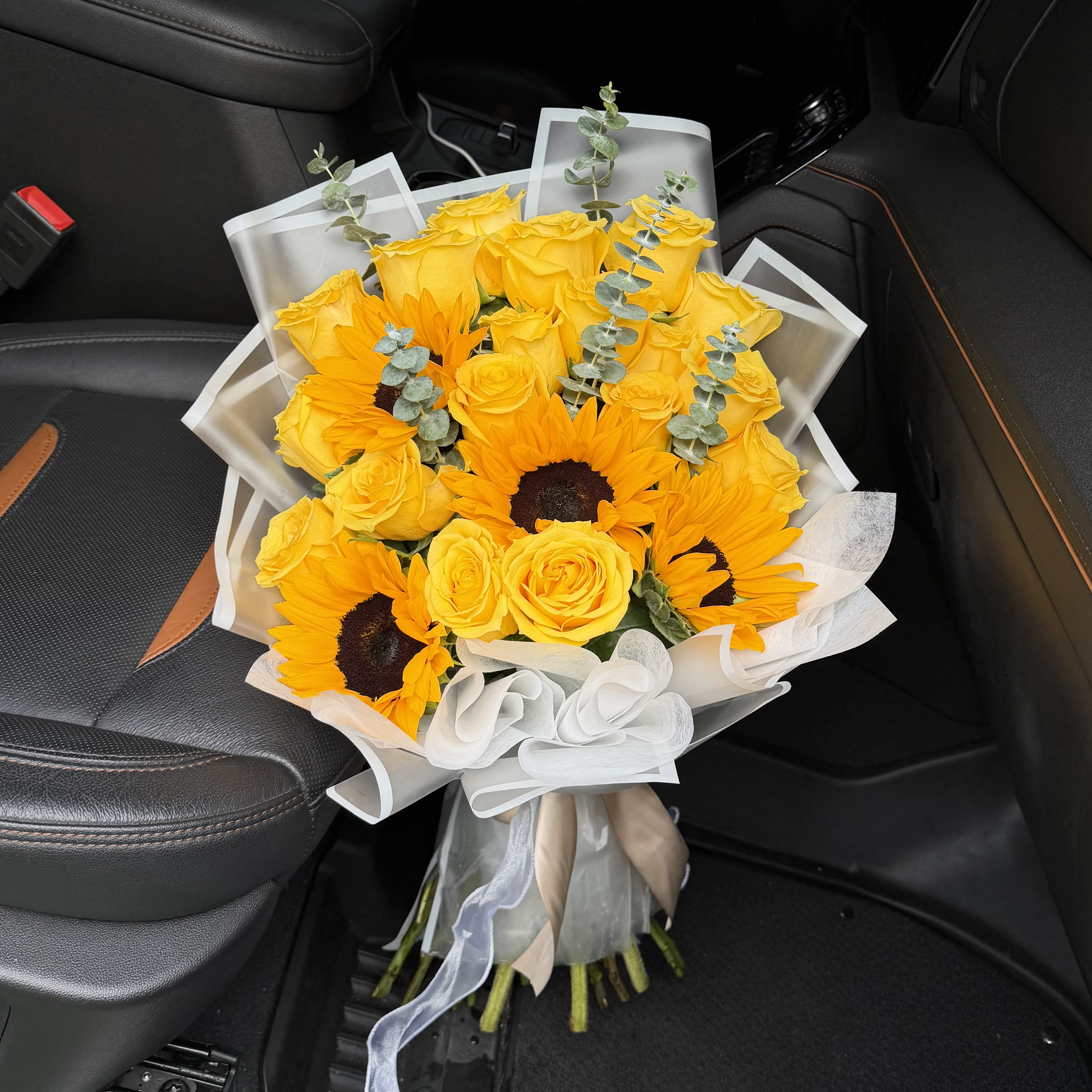Fields of Sunshine Bouquet - Bring warmth and happiness into any space with 'Fields of Sunshine', a radiant bouquet featuring bright sunflowers paired with yellow roses. Designed to capture the feeling of golden afternoons and joyful moments, this arrangement is perfect for birthdays, celebrations, thank-you gifts, or simply brightening someone's day! 