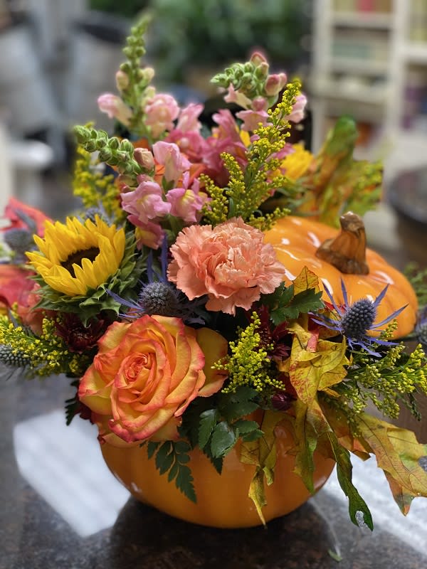For My Pumpkin - Bright fall flowers, leaves and more fill a hand-painted ceramic pumpkin that can be used over and over again. In fact, this pretty pumpkin is destined to carve out a special place in someone's home for years to come!  Colors and flowers vary by designer