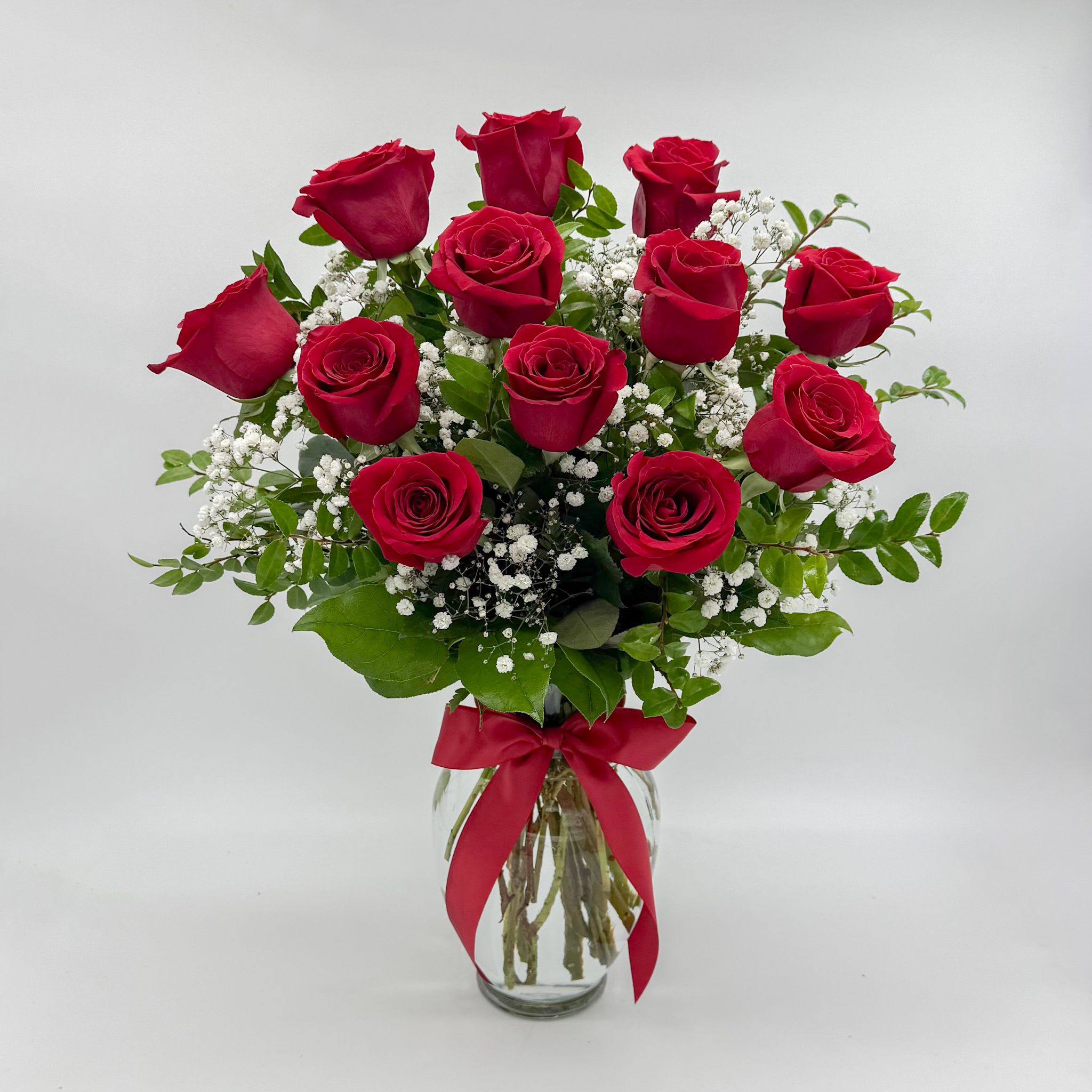 ** BEST SELLER **   The Flower Allie Perfect Dozen - Everything you think of when you think red roses. One dozen premium Ecuadorian roses with baby's breath and mixed green in a classic clear vase with a satin red bow. 