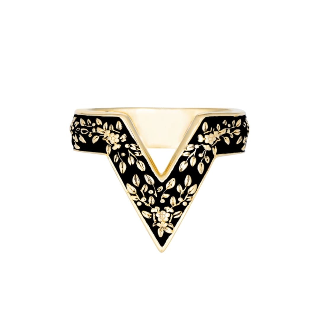 Black and gold floral-patterned ring with a pointed V-shaped design