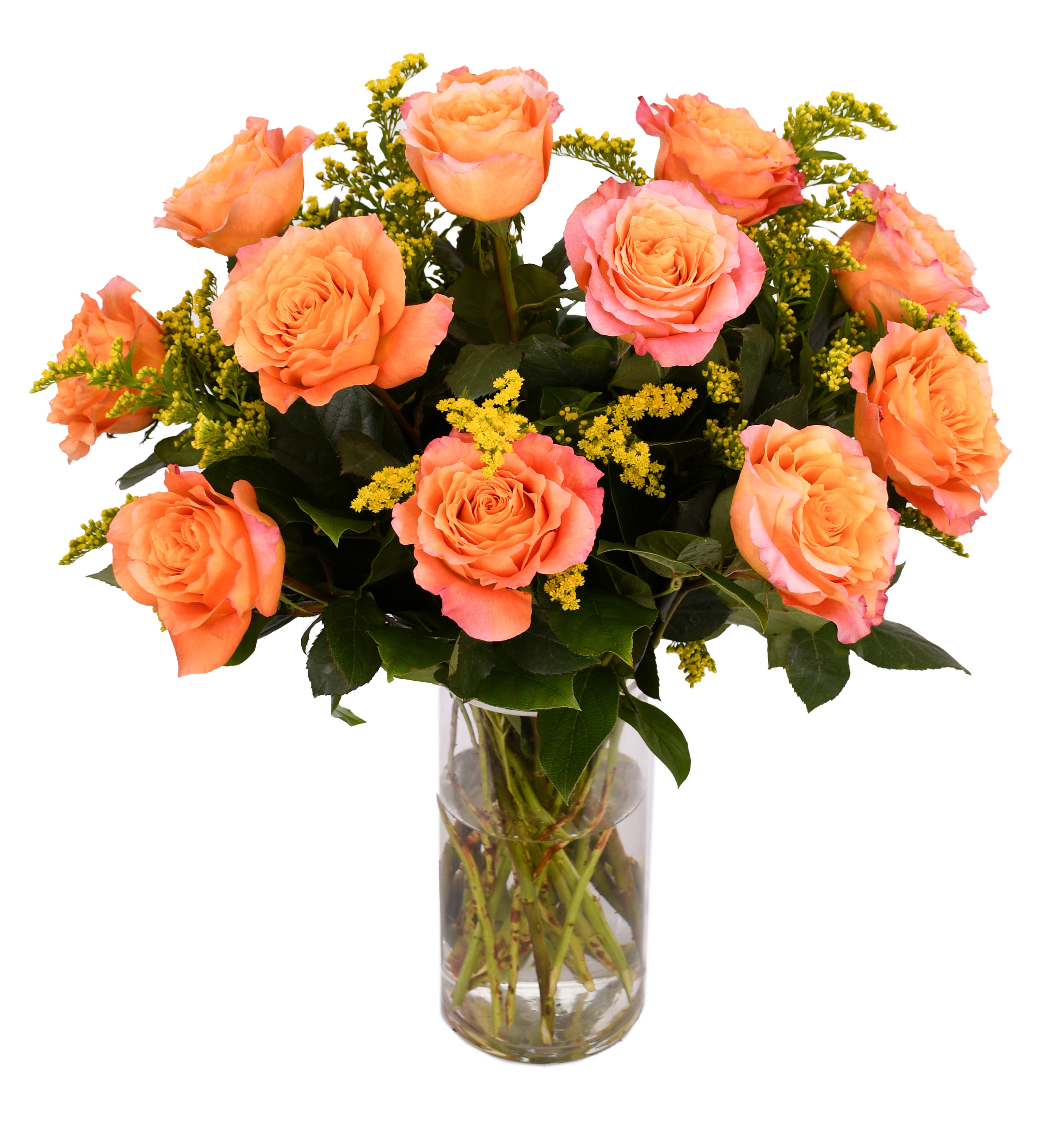 Orange roses arranged in a clear glass vase