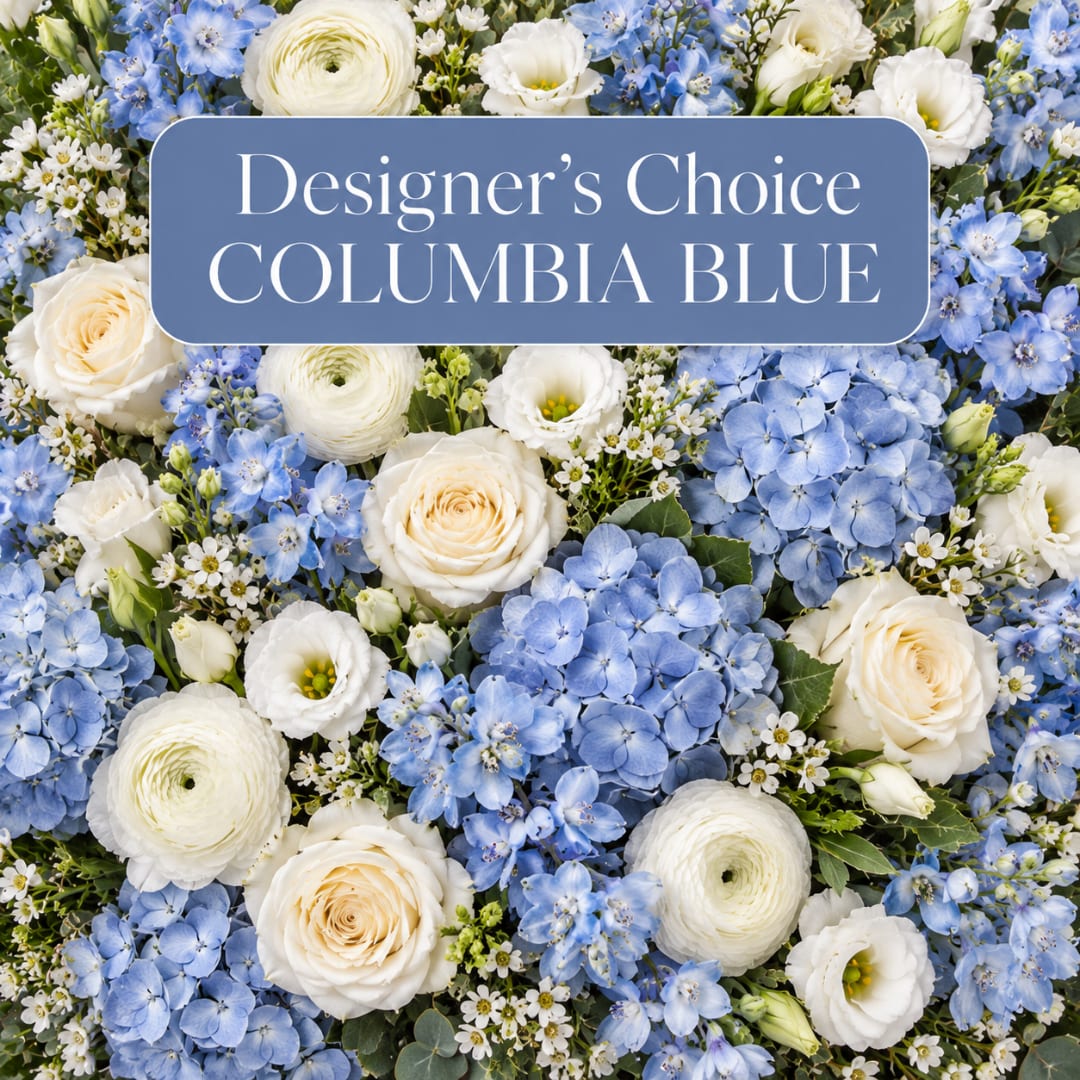 Blue and white floral arrangement with roses, hydrangeas, and ranunculus