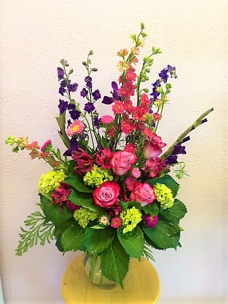 Just Because I Love You - Gorgeous mix arrangement on a clear vase with purple larkspur, green hydrangea, lavender roses, pink larkspur, pink alstroemerias and purple gladiolas.  For any occasion.