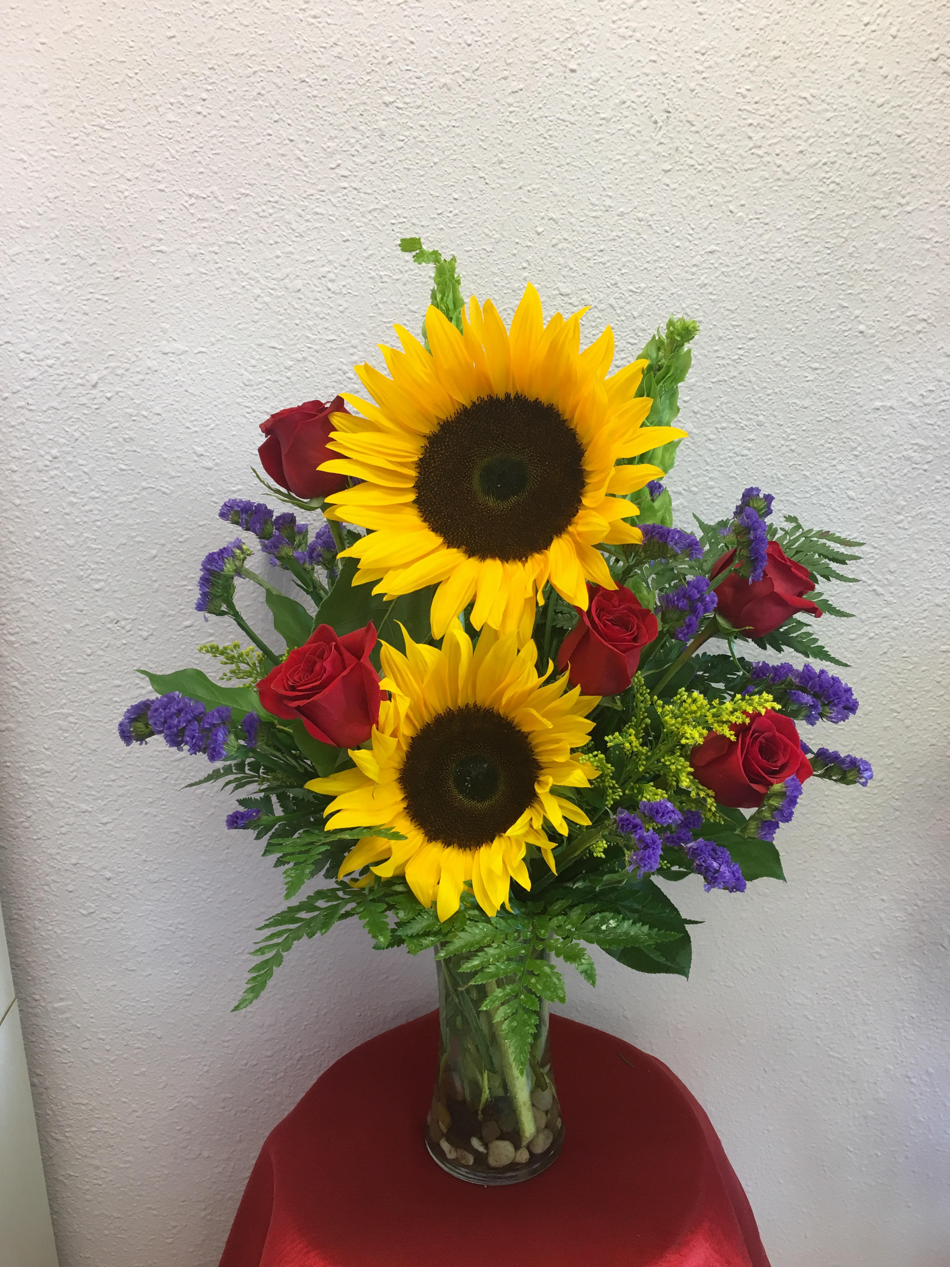 Sunny day  - Beautiful bouquet with gorgeous sunflowers, red roses and purple statice. 