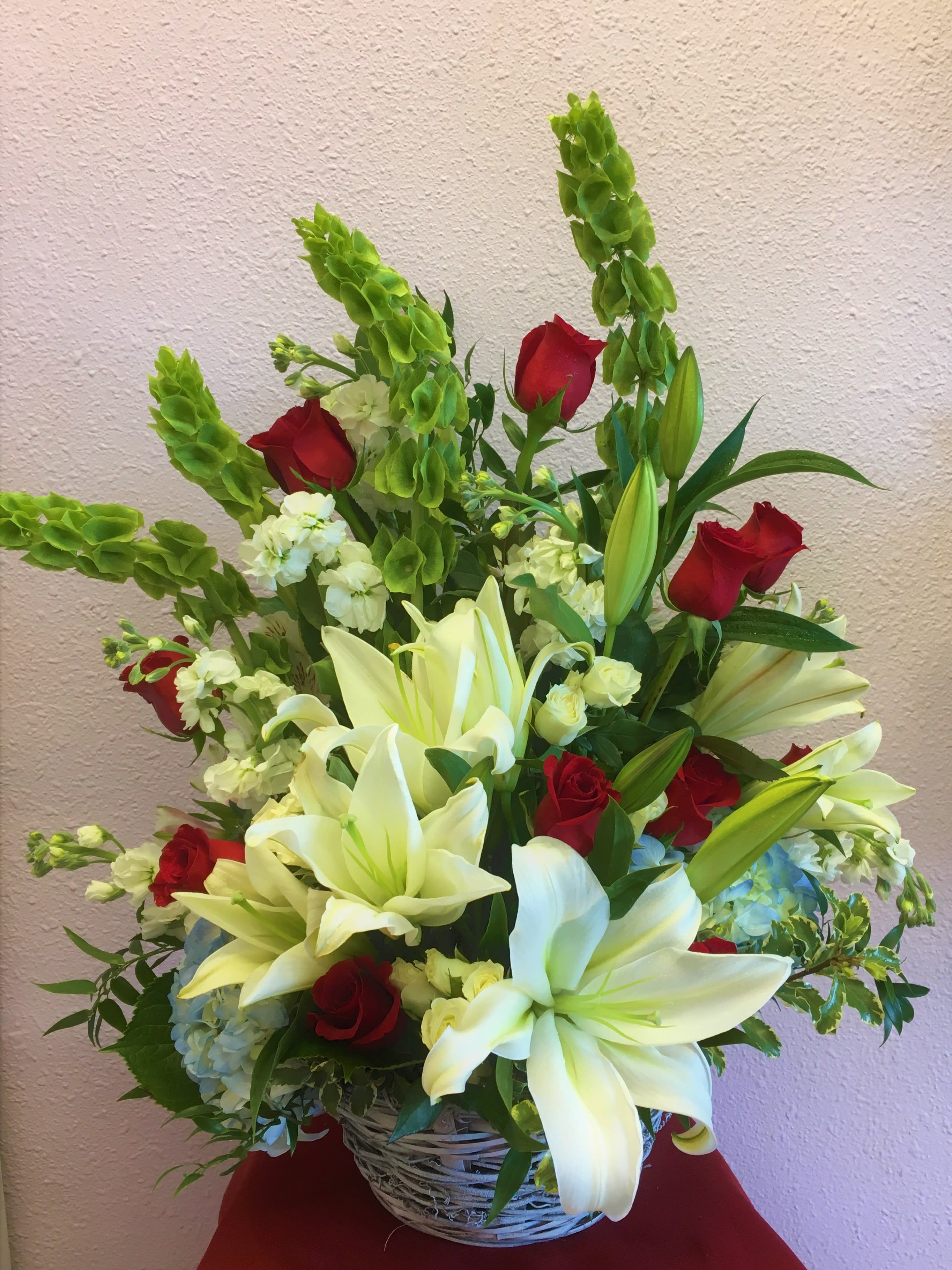 Thinking Of You by Forever Flowers - A big &amp; beautiful sympathy arrangement containing Roses, Lilies, Bells Of Ireland,  etc..