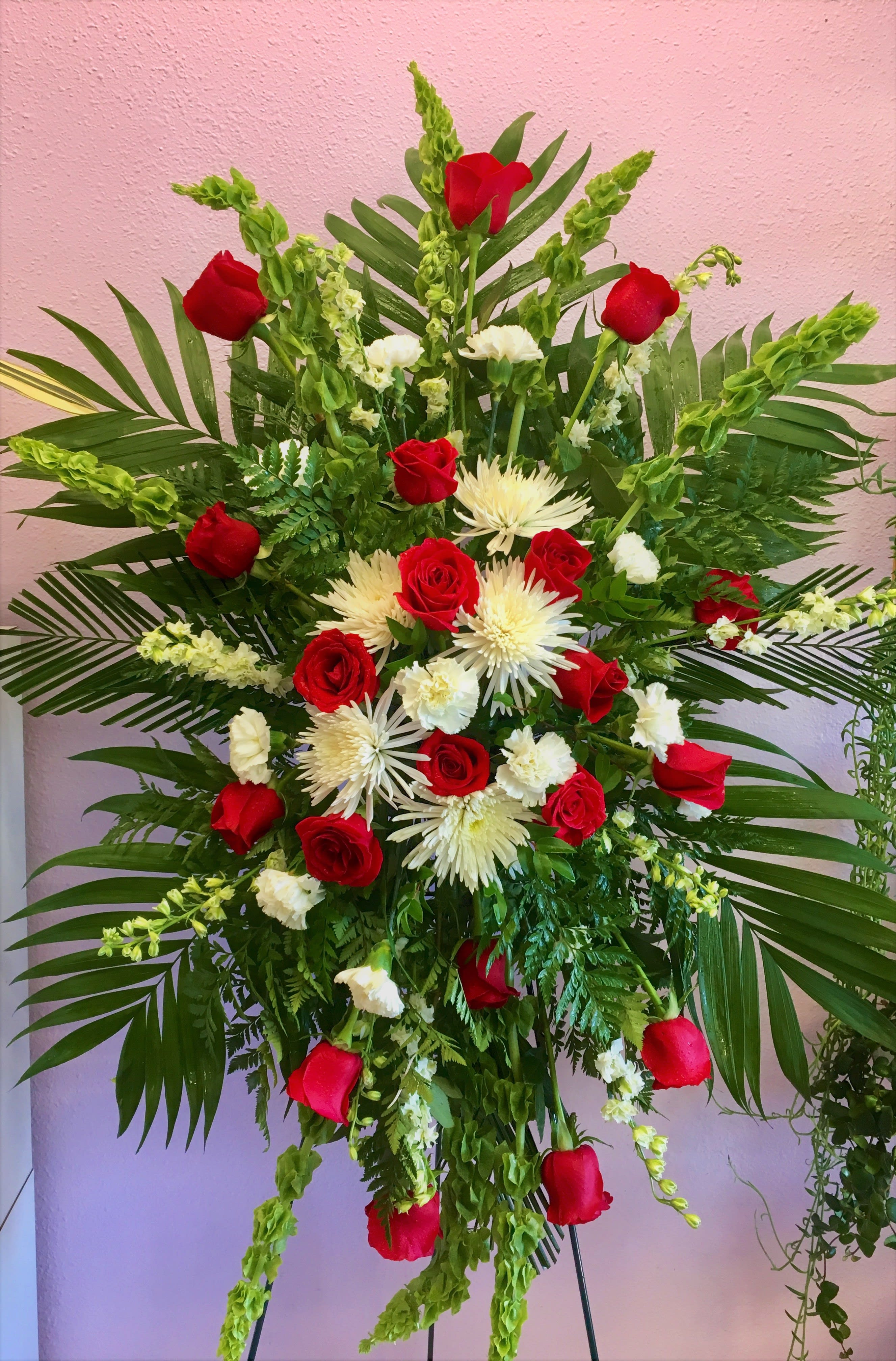 Tall floral spray with red roses and white spider mums