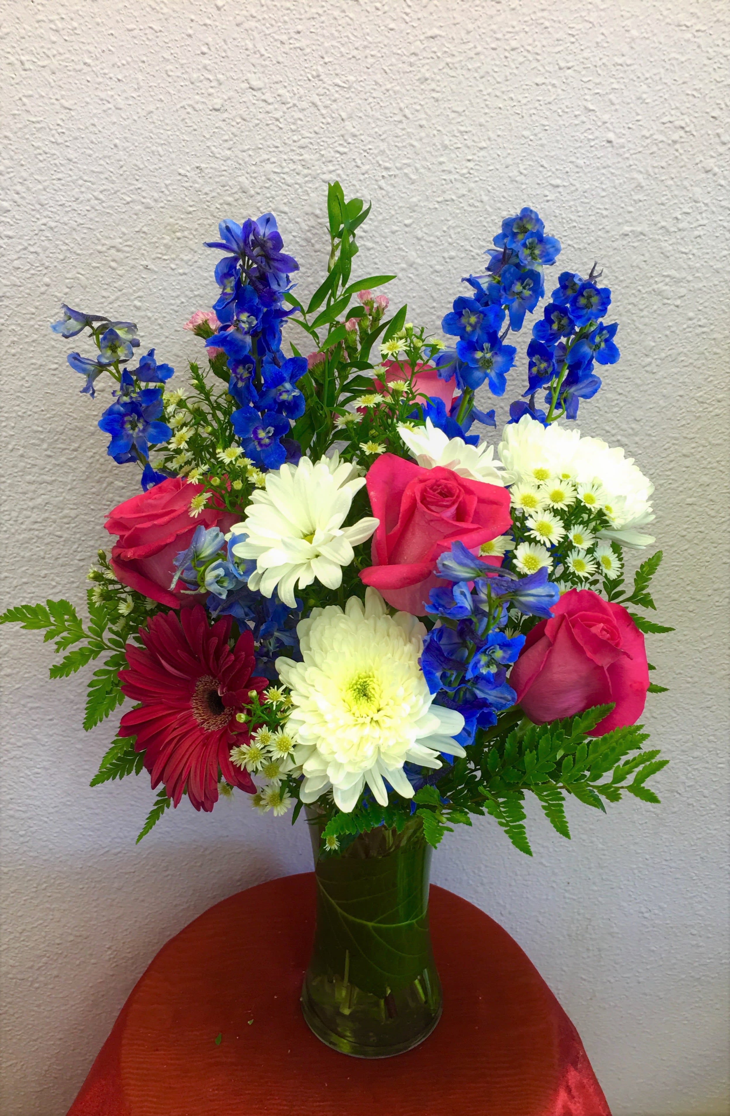 Blooming Blues by Forever Flowers - A pink &amp; blue arrangement containing delphiniums, roses, daisies, etc.. Perfect for any occasion!