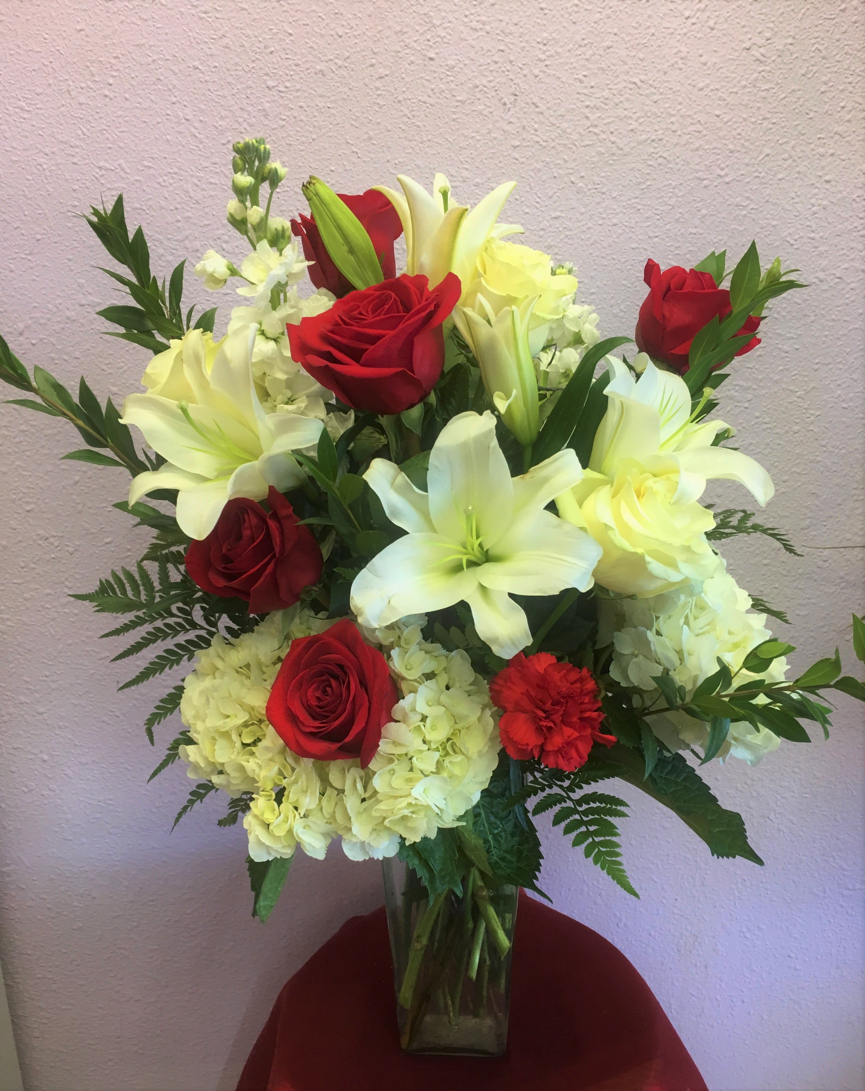 Kindest Love by Forever Flowers - A red &amp; white arrangement containing roses, hydrangeas, lilies, etc..