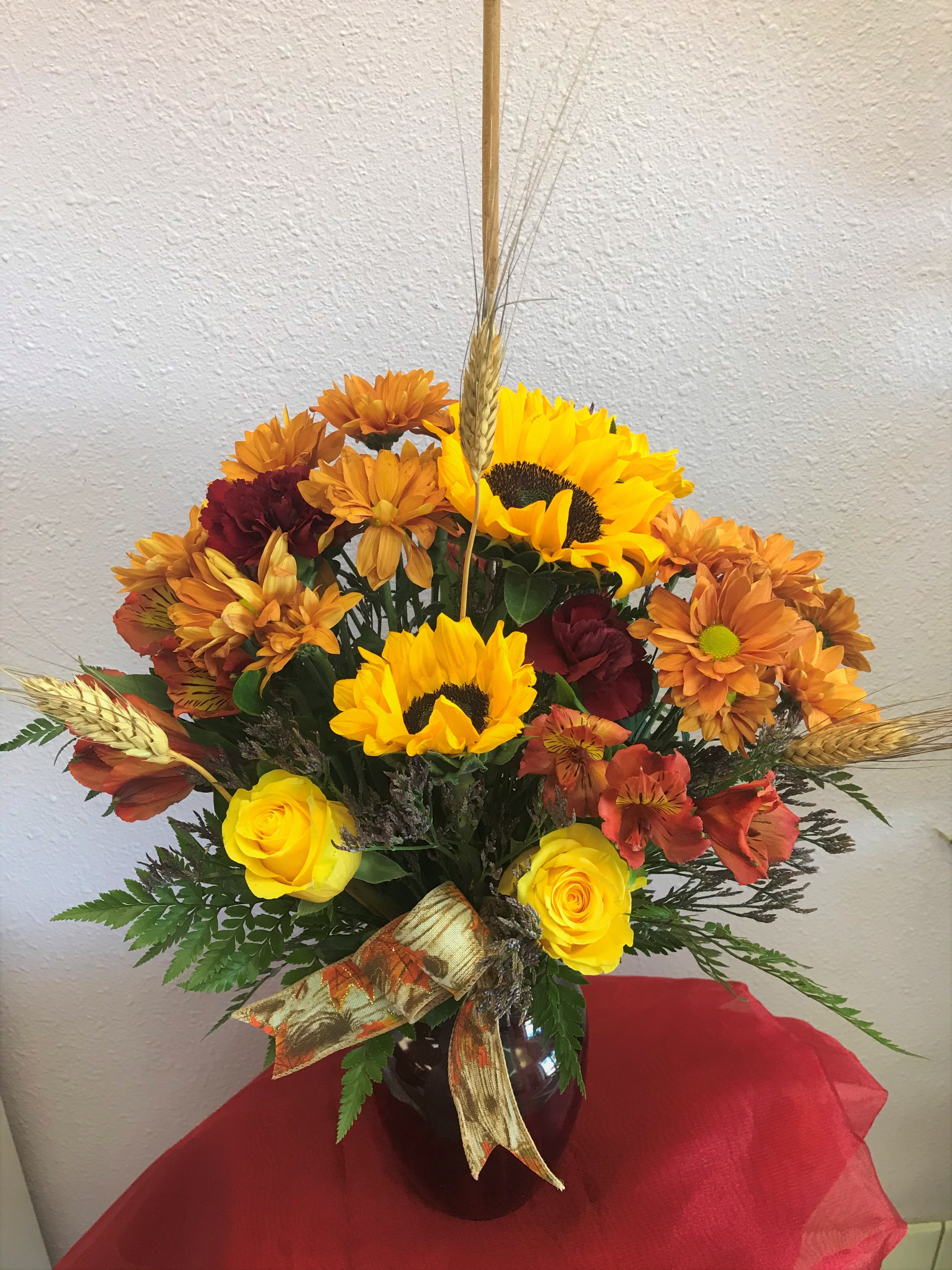 Colors of Autumn by Forever Flowers  - A fall colored arrangement containing Sunflowers, Daisies, Roses, Altros, Carnations. etc..
