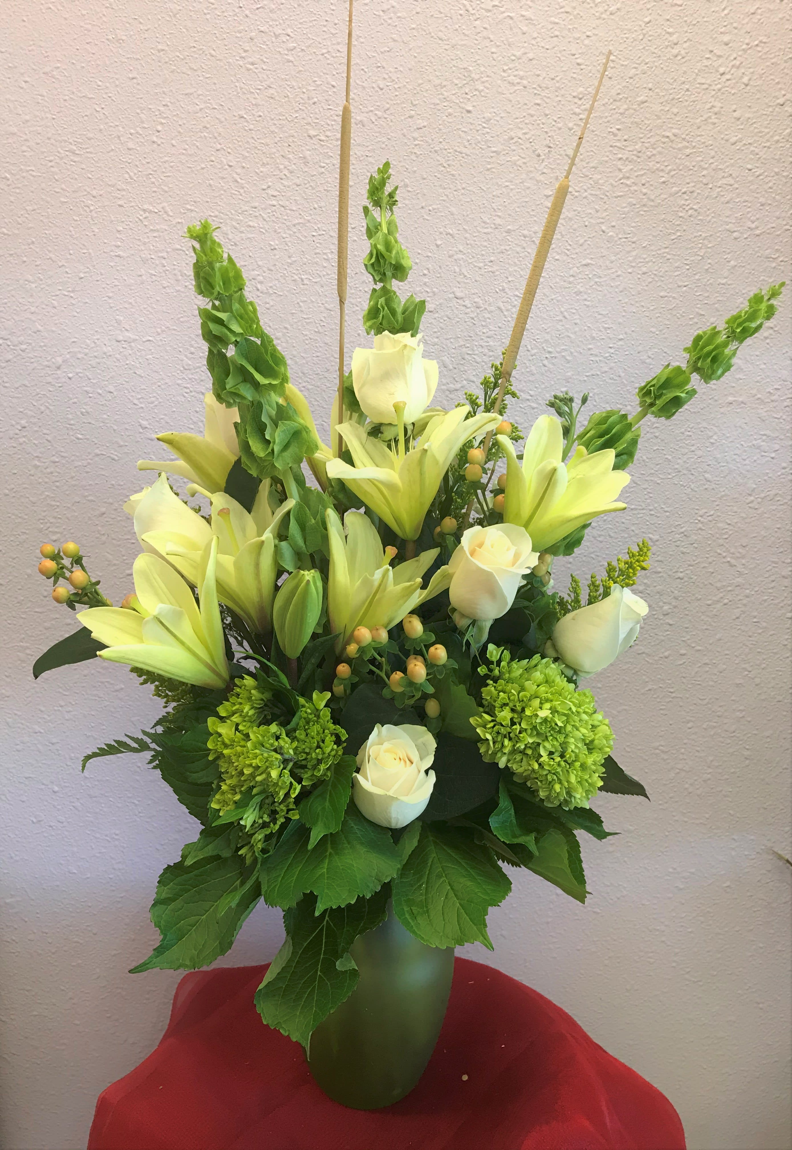 Jade Forest by Forever Flowers - A natural colored arrangement containing Lilies, Hydrangeas, Roses, Bell Of Ireland, etc..