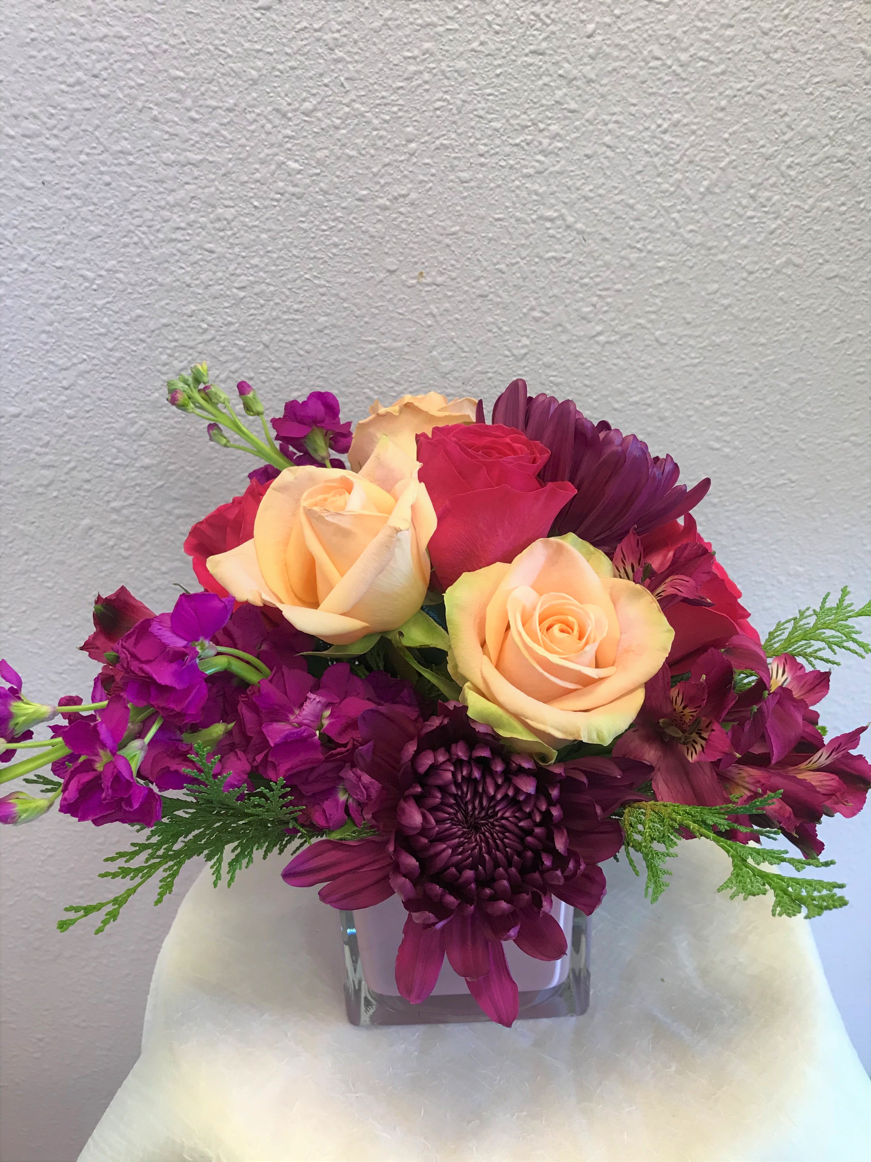 Peach Blush by Forever Flowers - A cube arrangement containing peach &amp; pink roses, mums, stock, &amp; more. 