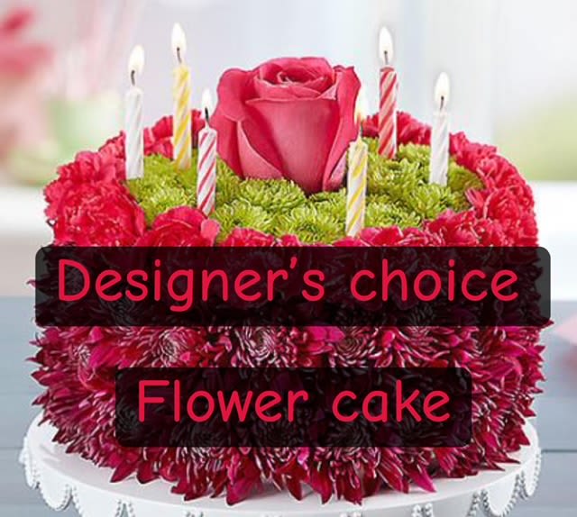 Flower cake with a pink rose and striped candle picks