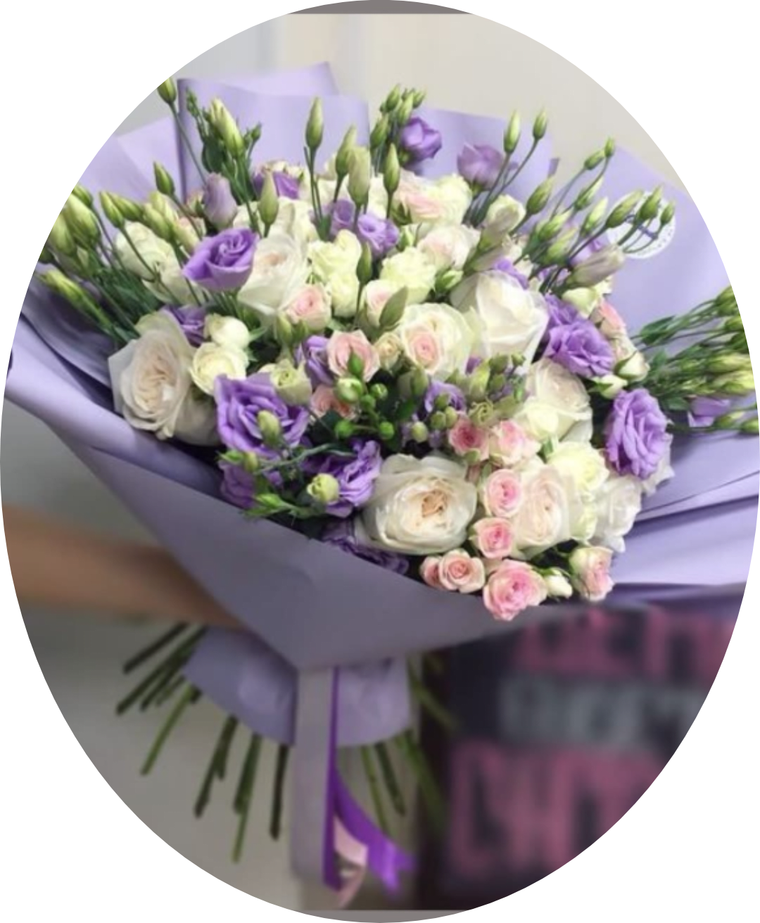 Lavender-wrapped bouquet of white and purple flowers