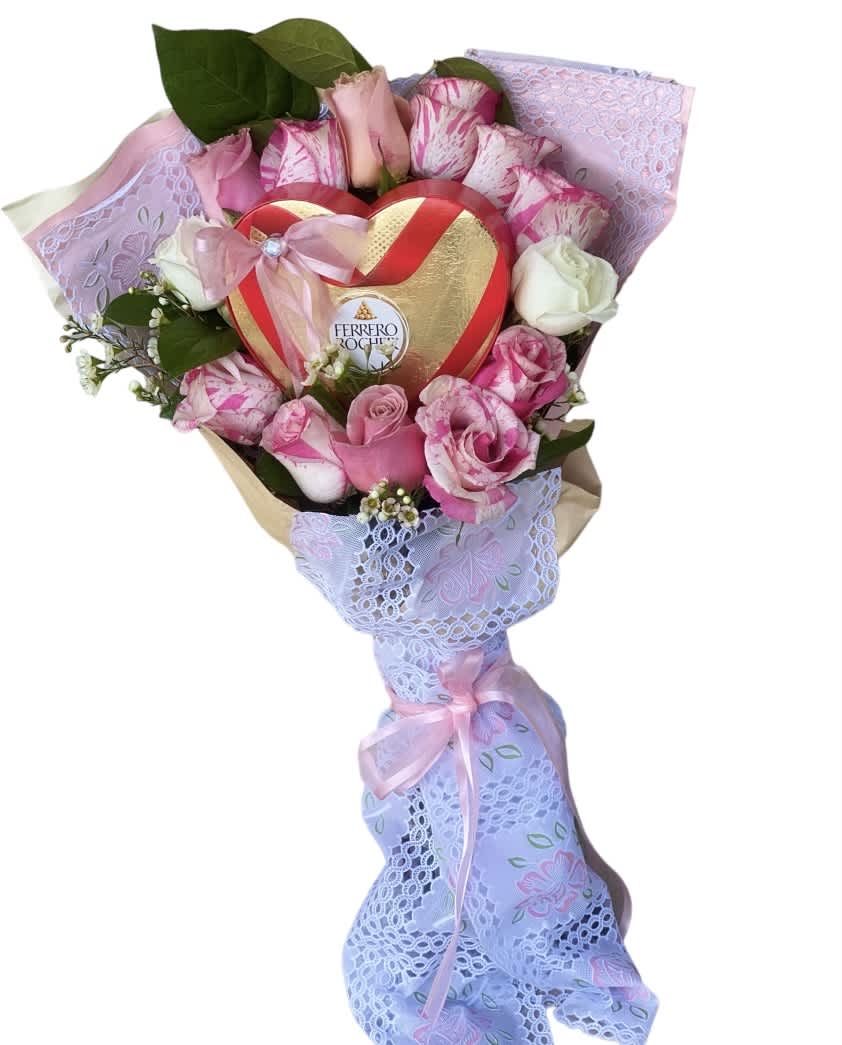 Pink and white rose bouquet with a heart-shaped chocolate box