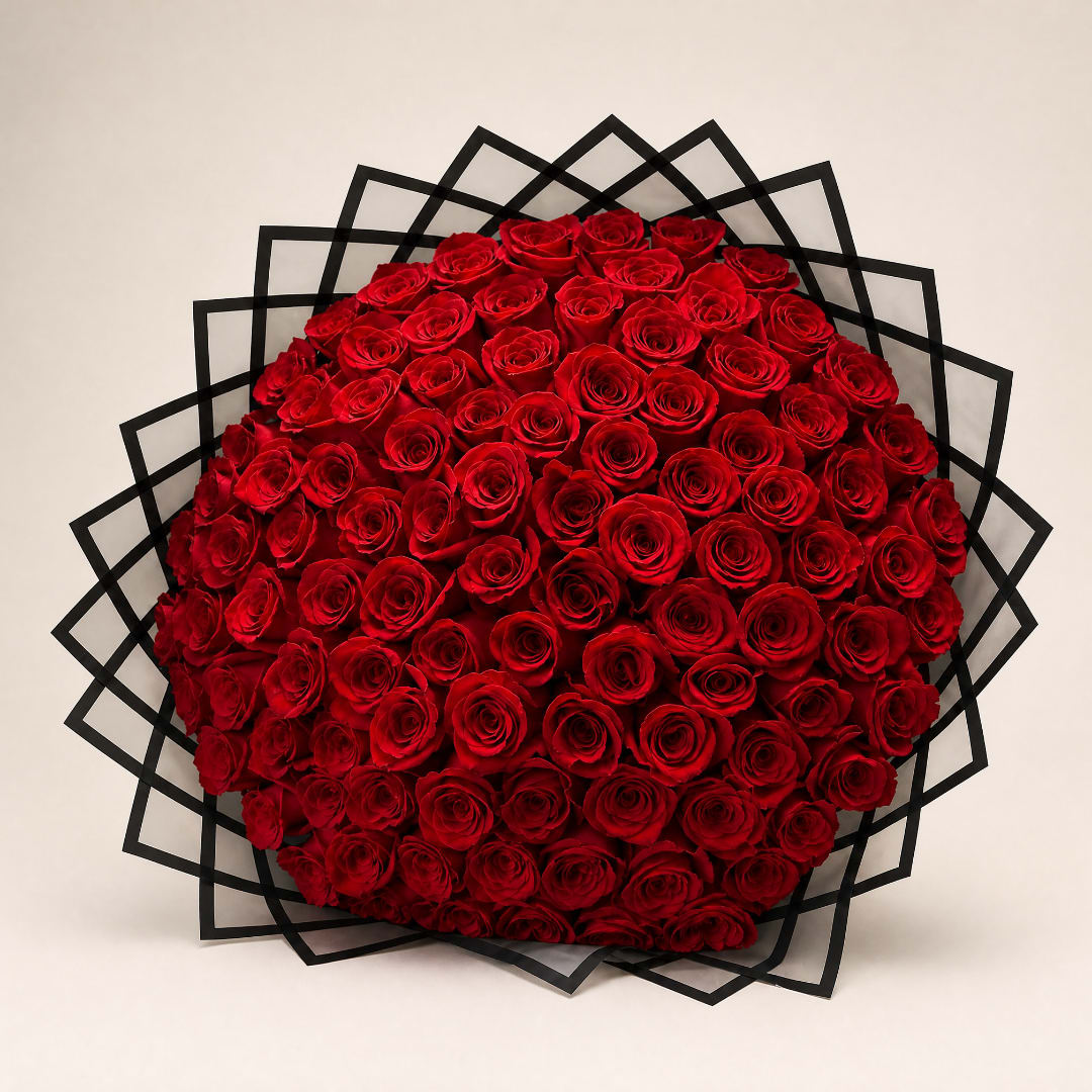 Large bouquet of red roses with black geometric wrapping