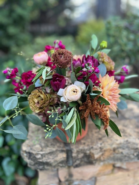 Fuchsia in Fall - A warm yet vibrant mix of stock, tulips, lisianthus, antique hydrangea and ranunculus finished with eucalyptus and olive; the perfect color palette for any occasion this Fall. 