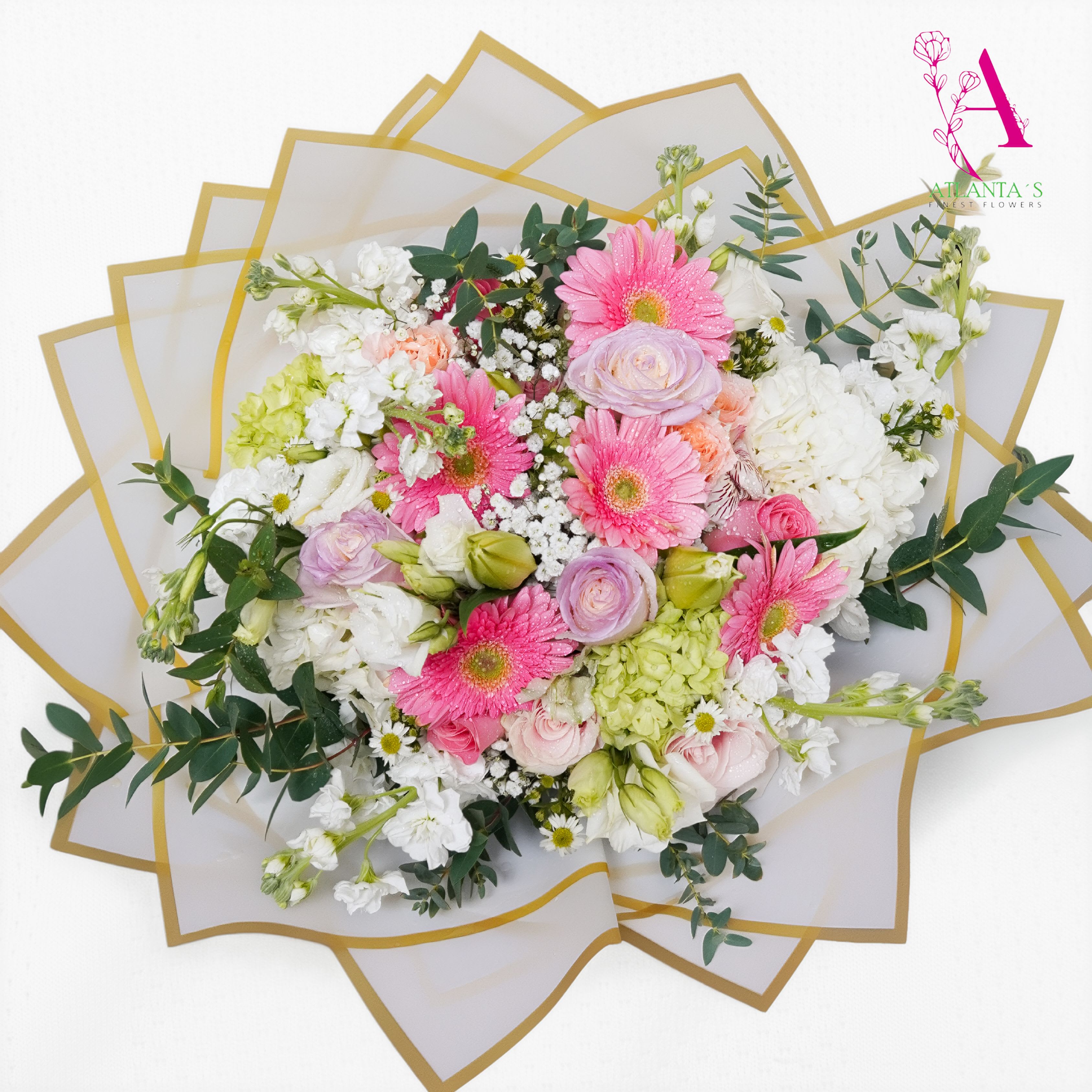 Sweet Serenity Bouquet - A charming garden-style bouquet featuring soft pink gerbera daisies, pastel roses, lush white hydrangeas, white stock, and greenery. Designed in a beautiful pastel palette and wrapped with white paper, this arrangement brings warmth, joy, and elegance to any occasion. Perfect for birthdays, celebrations, thank-you gifts, or simply brightening someone's day!