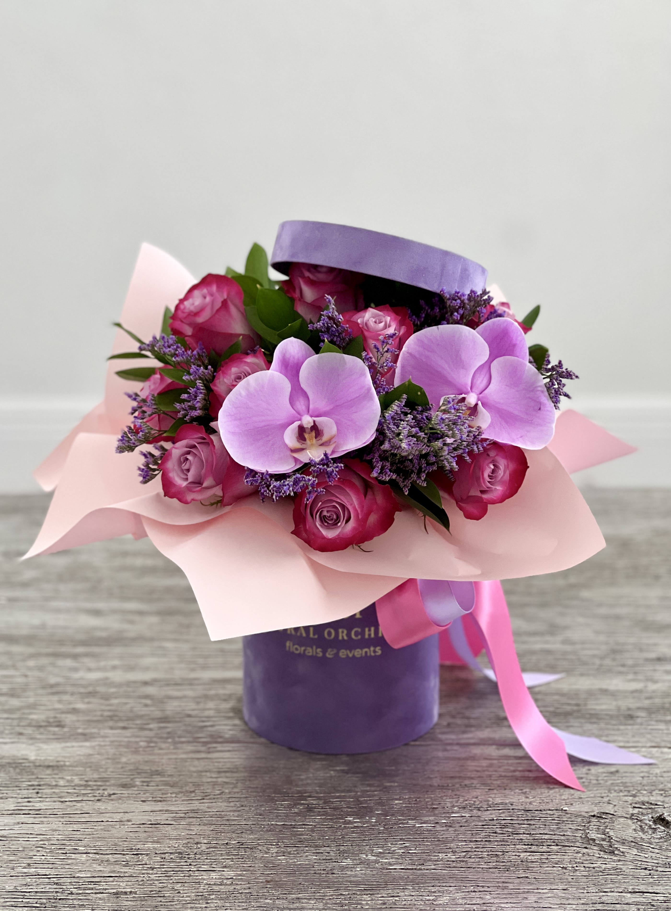 Lavender Devotion ™ - Arrangement of Deep Purple roses, and Orchids in a beautiful velvet flower box