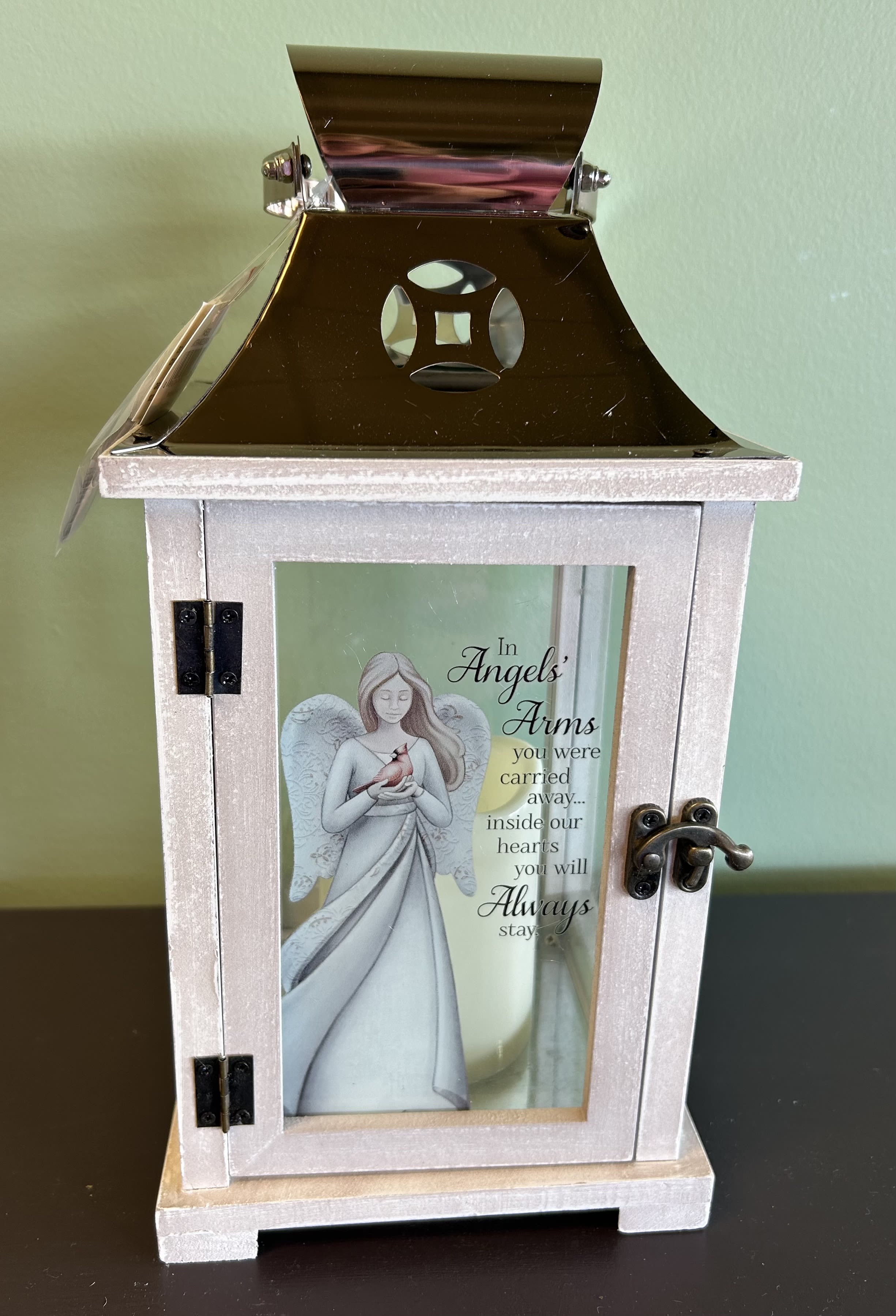 Decorative memorial lantern with an angel illustration and sympathy message