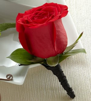 Single red rose boutonniere with white ribbon wrap