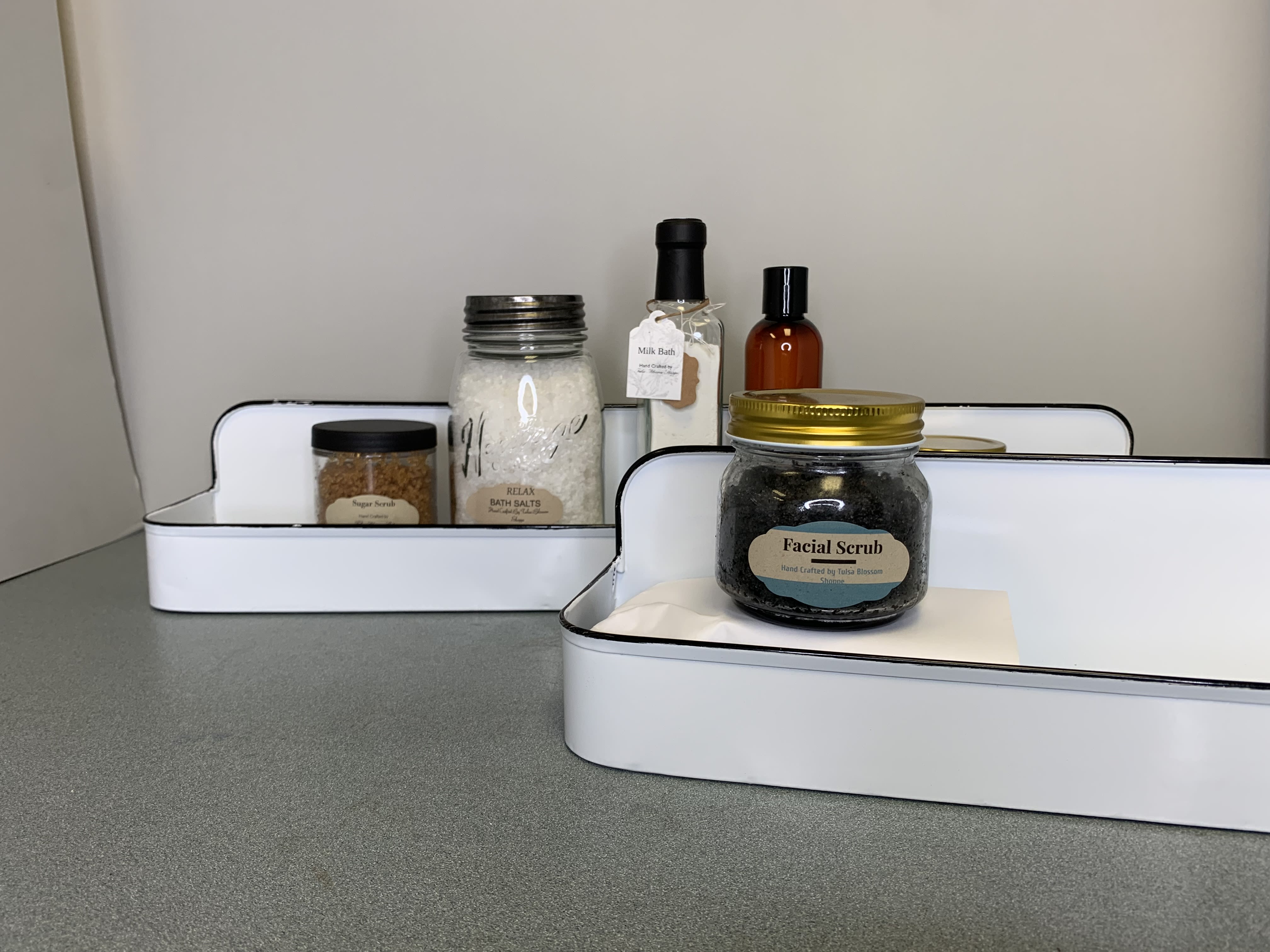 Gift trays with bath and body products in jars and bottles
