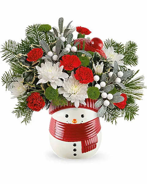 Snowman vase with red and white flowers and evergreen accents
