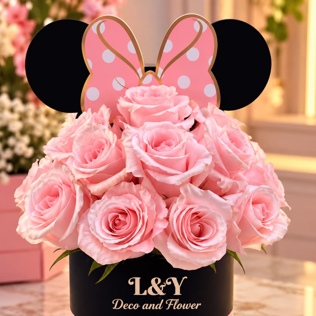 Pink roses in a black box with a Minnie Mouse-style topper