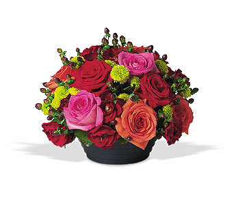 Mixed roses in a low black container