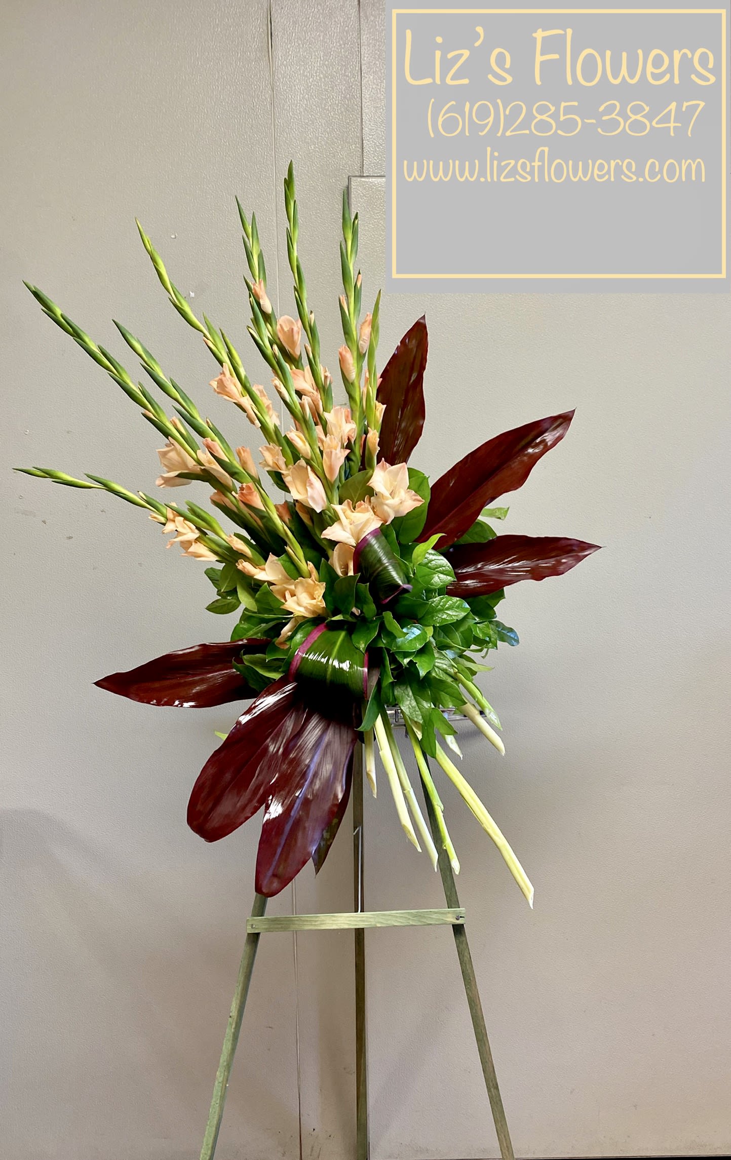 Elegant Gladioli Tribute Spray  - While beautiful and striking gladioli often symbolize strength and dignity, this dazzling coral display acknowledges a passion for living life to its fullest. A message that will surely be appreciated by anyone mourning a loved one. 