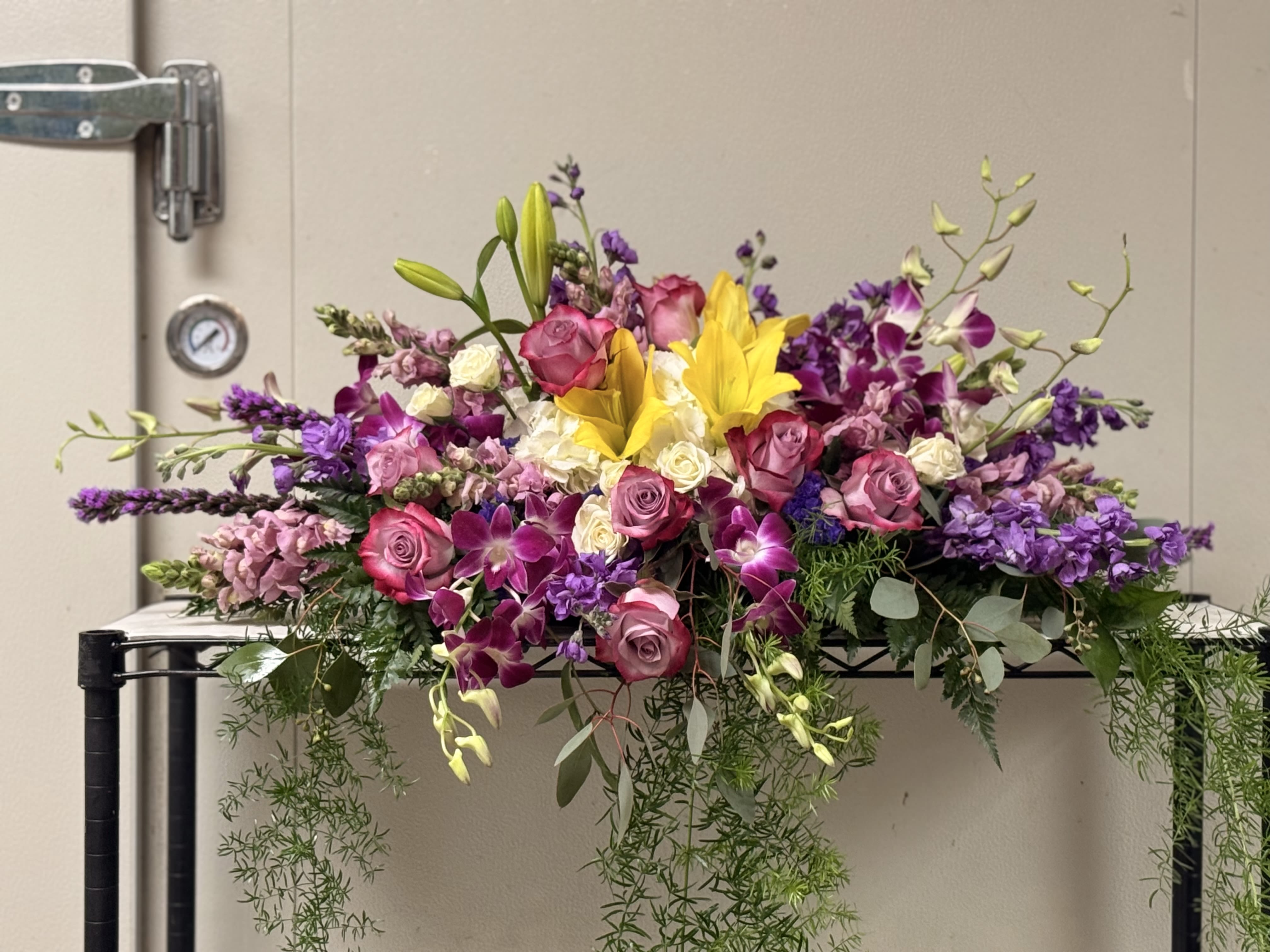 Sweetheart table arrangement  - Extra-wide, horizontal garden-style spread. Best for rectangular or round sweetheart table. 