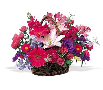 Mixed flower basket with pink lilies, gerbera daisies, and roses