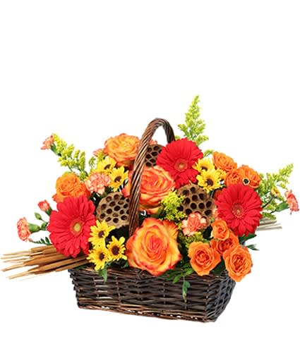 Basket arrangement of orange and red flowers with yellow accents